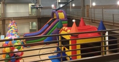 Bouncy houses with slide inside gym